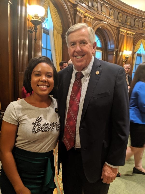 In 2019, Asia Wallace, NFP parent ambassador, met Governor Mike Parson at a bill signing at the Missouri State Capitol.