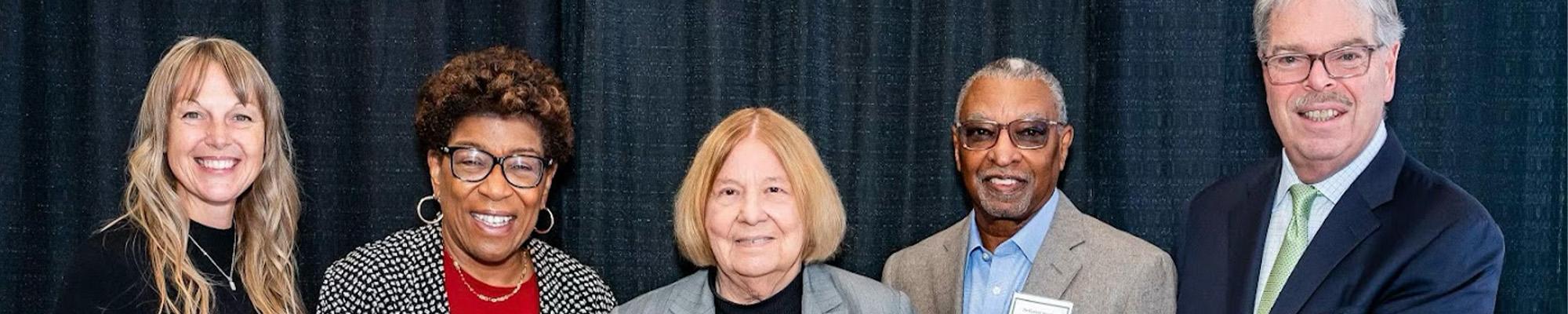 Gloria Aftanski and Dale Callender accepting a $12,500 check from the Provident Bank Foundation.