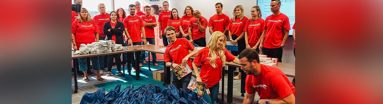 Travelers Insurance volunteers in Edison packed health and hygiene kits, supplied by their company, that contained backpacks, toiletries and socks for the homeless.
