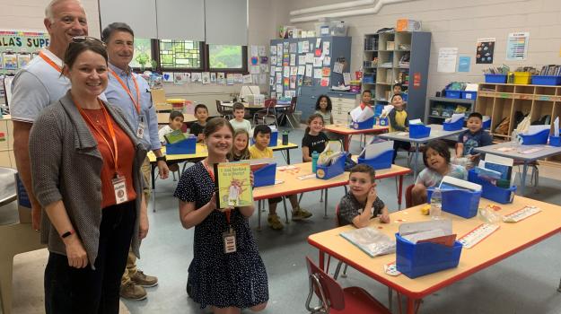 Volunteers from Johnson & Johnson donated new children's books to JFK Elementary School in Jamesburge