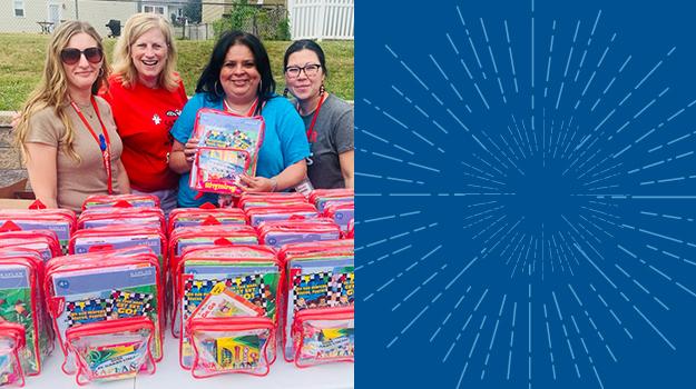 Our Jamesburg Family Advocate, Debbie Cruz, is pictured with JFK Elementary School staff and bookbags for pre-k students.