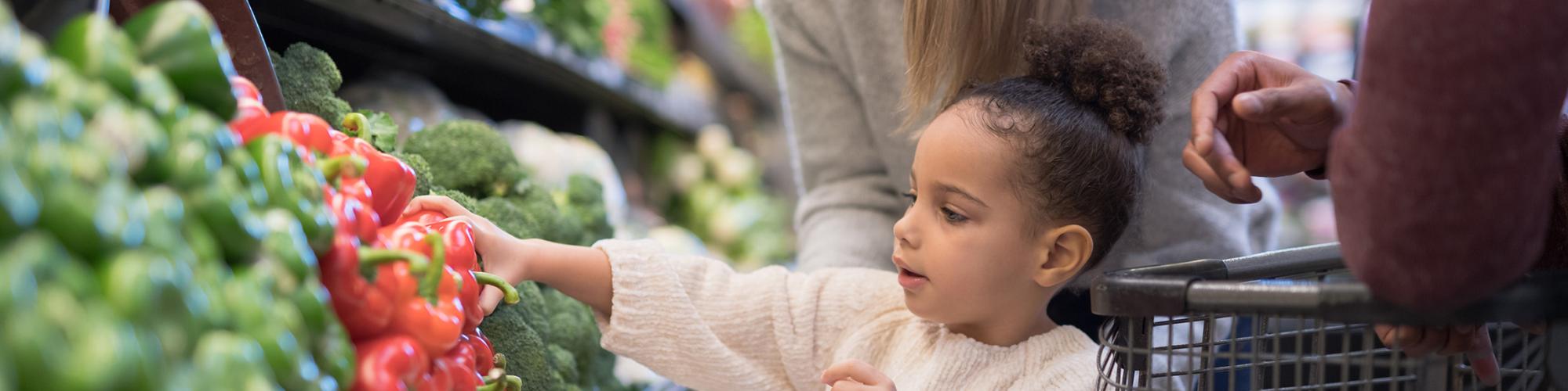 child picking out healthy food